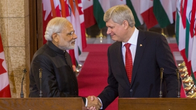Prime Minister of Canada Stephen Harper and Narendra Modi, Prime Minister of India, shake hands following a joint press conference in Centre Block on Parliament Hill.